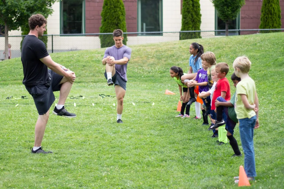 Kids warming up before soccer practice