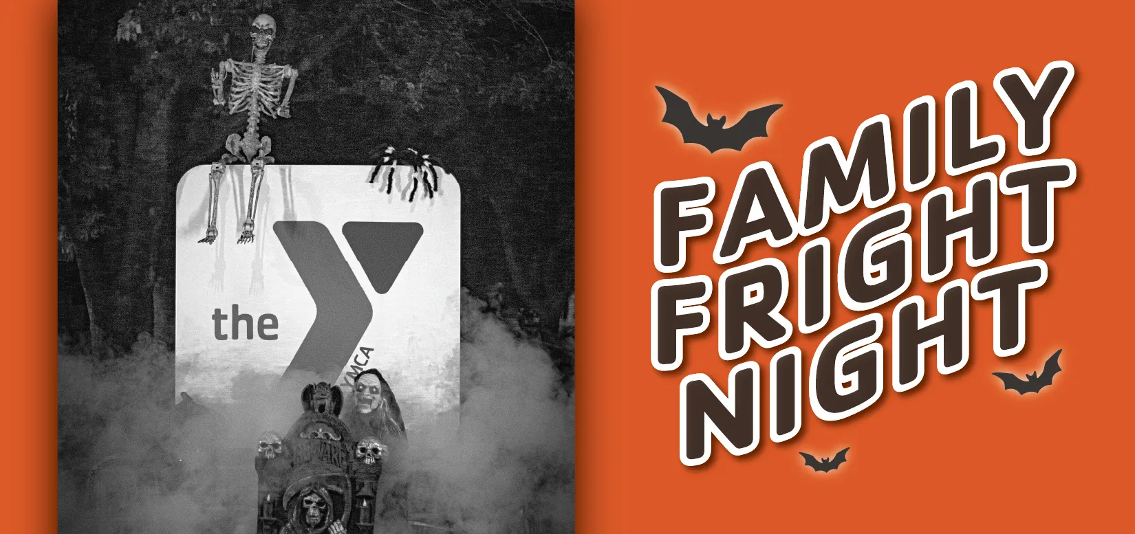 Text reading "FAMILY FRIGHT NIGHT" sits on the right side of an orange rectangle. To the left is a black-and-white photo of a large outdoor sign displaying the YMCA logo at night. Thick fog wafts around the base, contributing to the spooky atmosphere created by the various Halloween decorations (such as a human-sized skeleton, a giant spider, and a witch peering over a tombstone with skulls) placed on and around the sign.